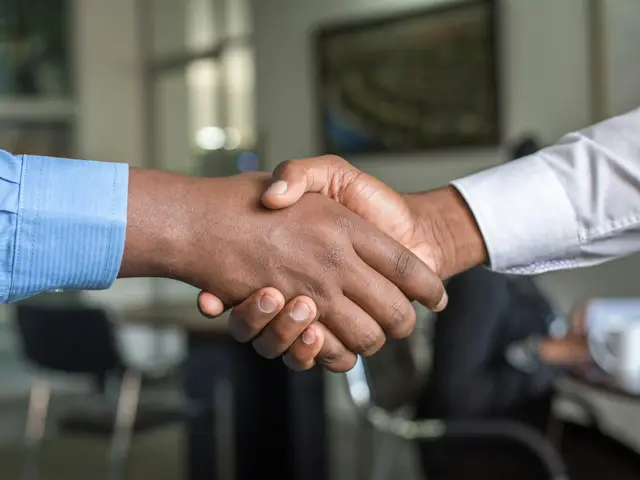 Business handshake in an office